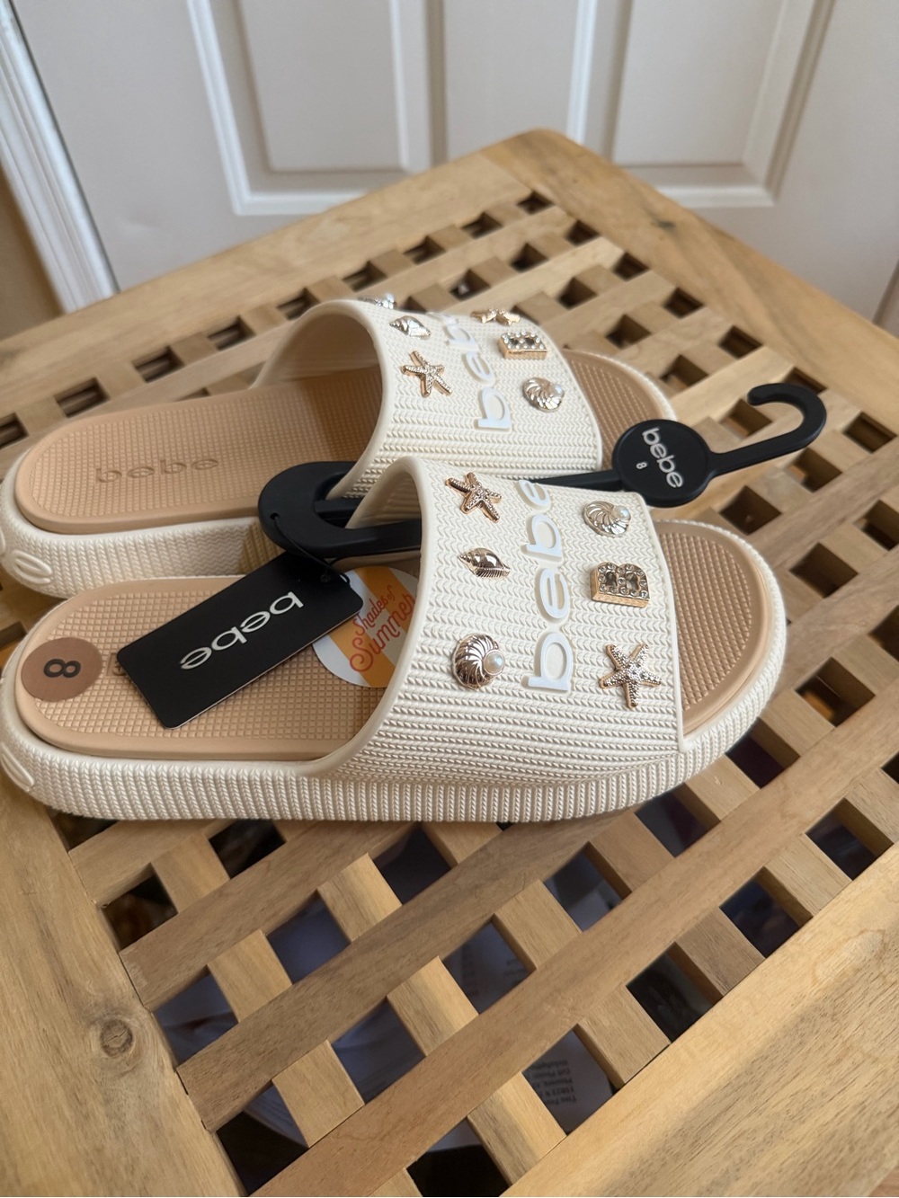 Bebe Cream Slide Sandals with Gold Charm Accents
